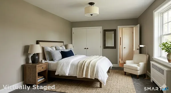 a bedroom with a bed and furniture