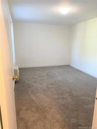an empty room with a bench