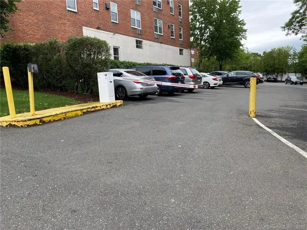 a view of street with parked cars