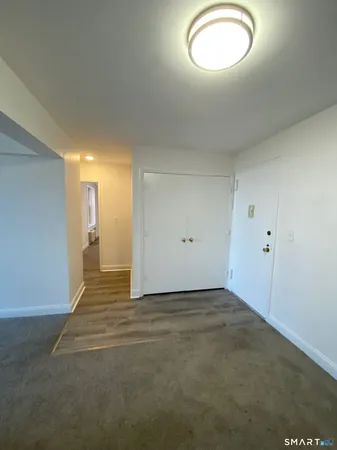 an empty room with a empty space and windows