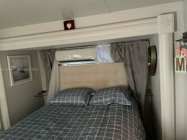 a kitchen with refrigerator and window