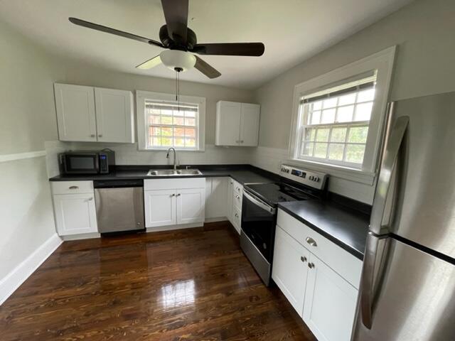 3607 Cove Road Roanoke, VA 24017 - Photo 3 of 9 a kitchen with granite countertop a sink stainless steel appliances and window