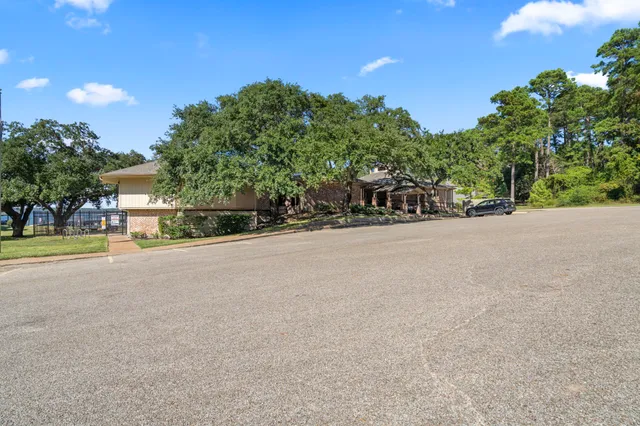 a view of a road with a building in the background