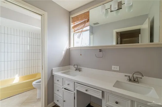 a bathroom with a sink and a bathtub