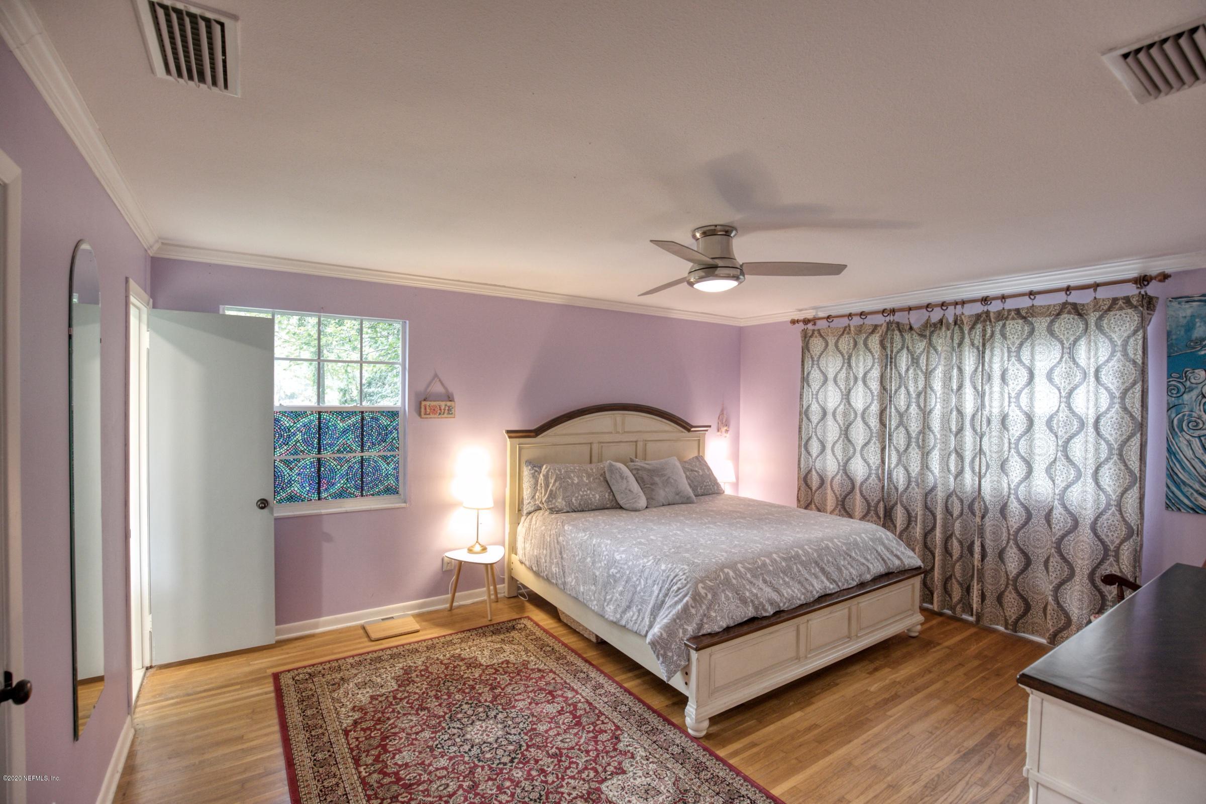 9439 Conifer Road Jacksonville, FL 32257 - Photo 44 of 60 a bedroom with a bed and window