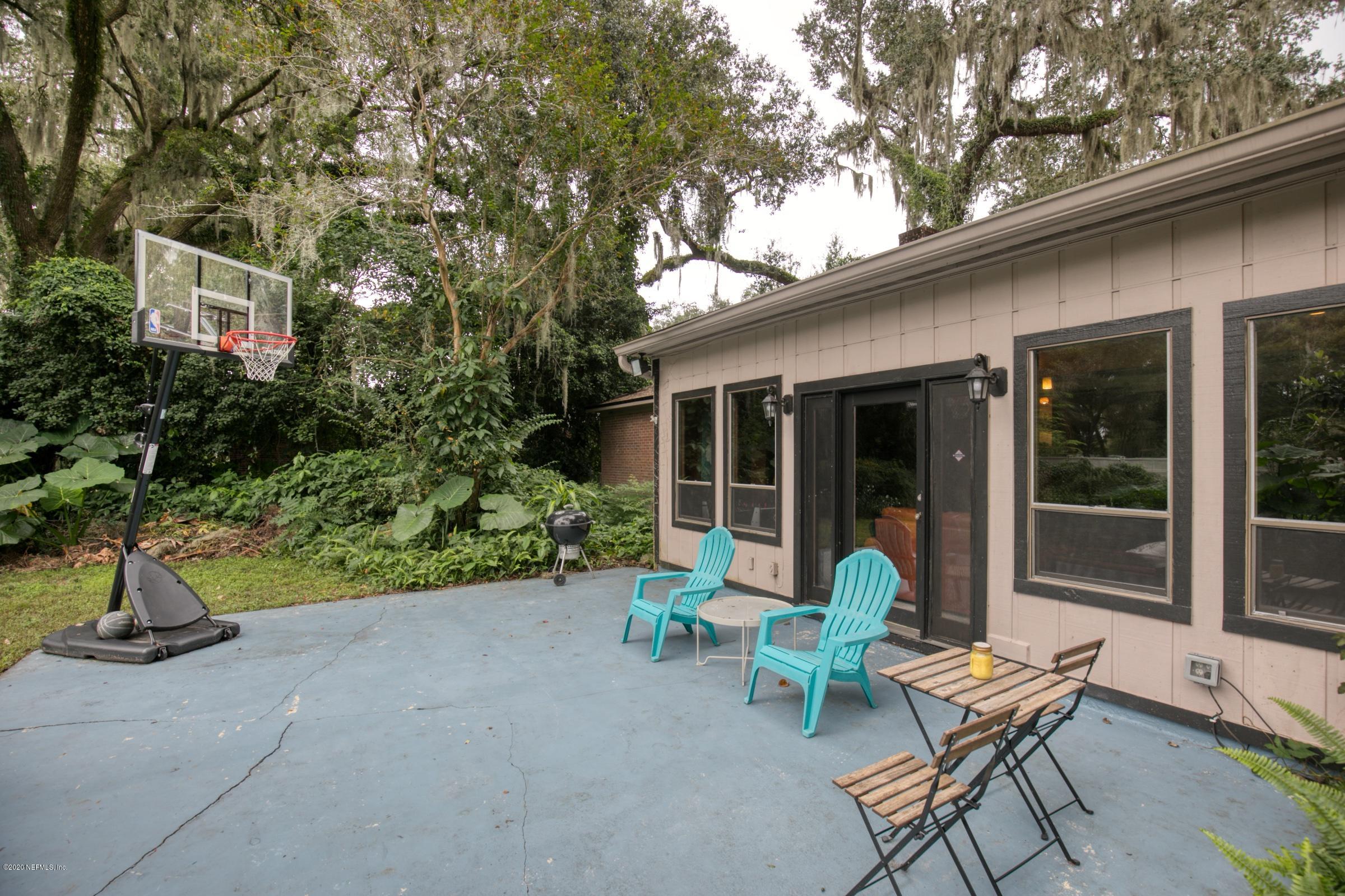 9439 Conifer Road Jacksonville, FL 32257 - Photo 54 of 60 a view of a bench in front of house