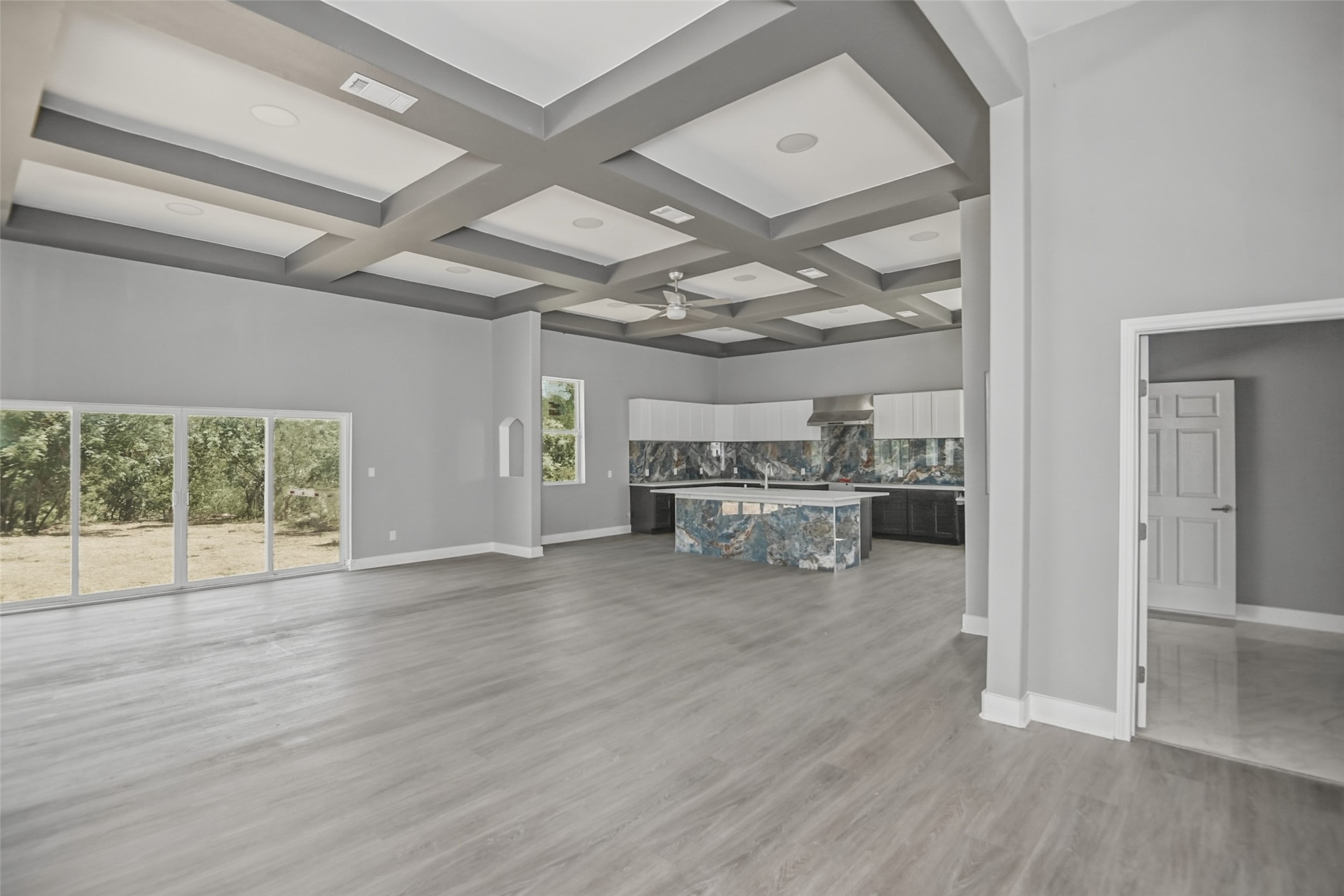 14300 Fallen Timber Drive Austin, TX 78734 - Photo 12 of 35 a view of a room with wooden floor and a ceiling fan