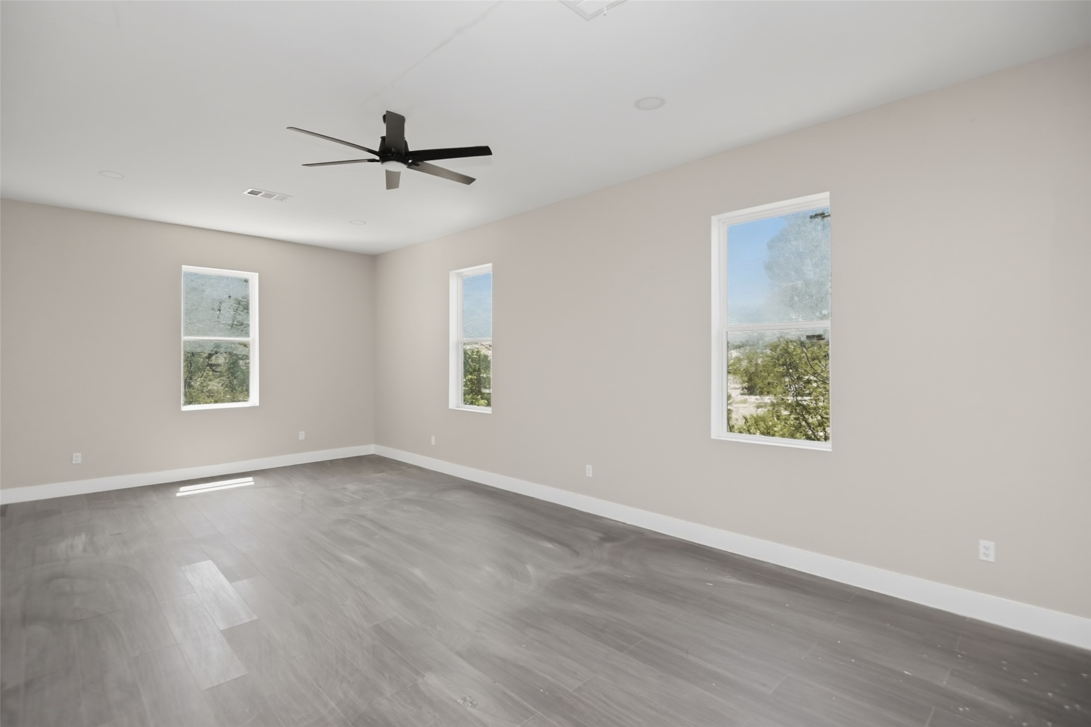 14300 Fallen Timber Drive Austin, TX 78734 - Photo 23 of 35 wooden floor in an empty room with a window