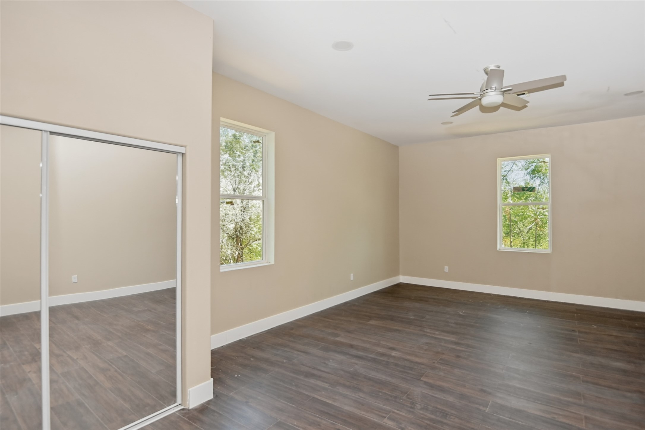 14300 Fallen Timber Drive Austin, TX 78734 - Photo 26 of 35 an empty room with windows and closet