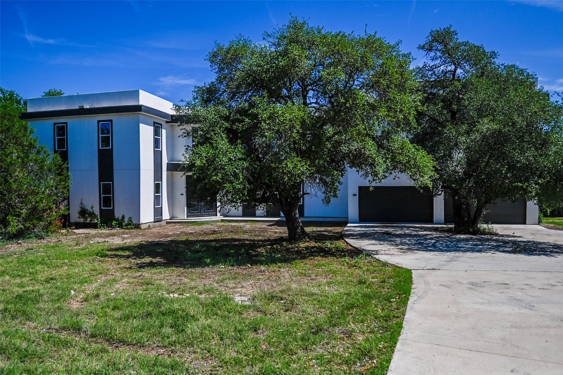 14300 Fallen Timber Drive Austin, TX 78734 - Photo 3 of 35 a front view of a house with a yard