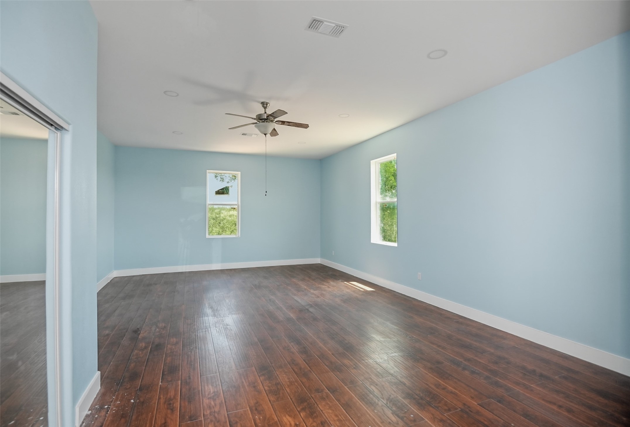 14300 Fallen Timber Drive Austin, TX 78734 - Photo 33 of 35 a view of an empty room with window and wooden floor