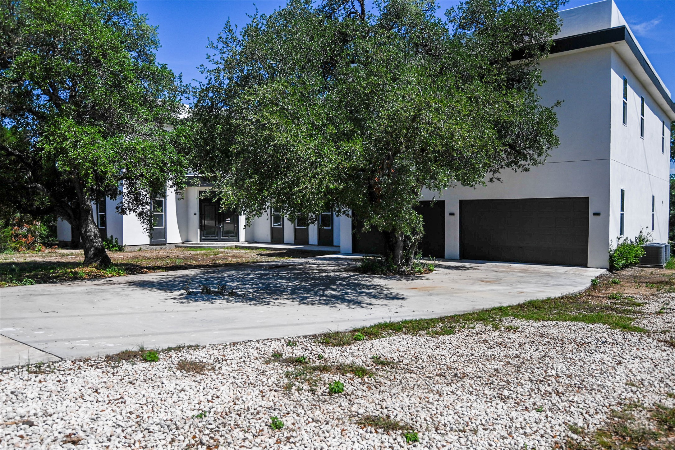 14300 Fallen Timber Drive Austin, TX 78734 - Photo 4 of 35 a view of a house with a yard and large tree