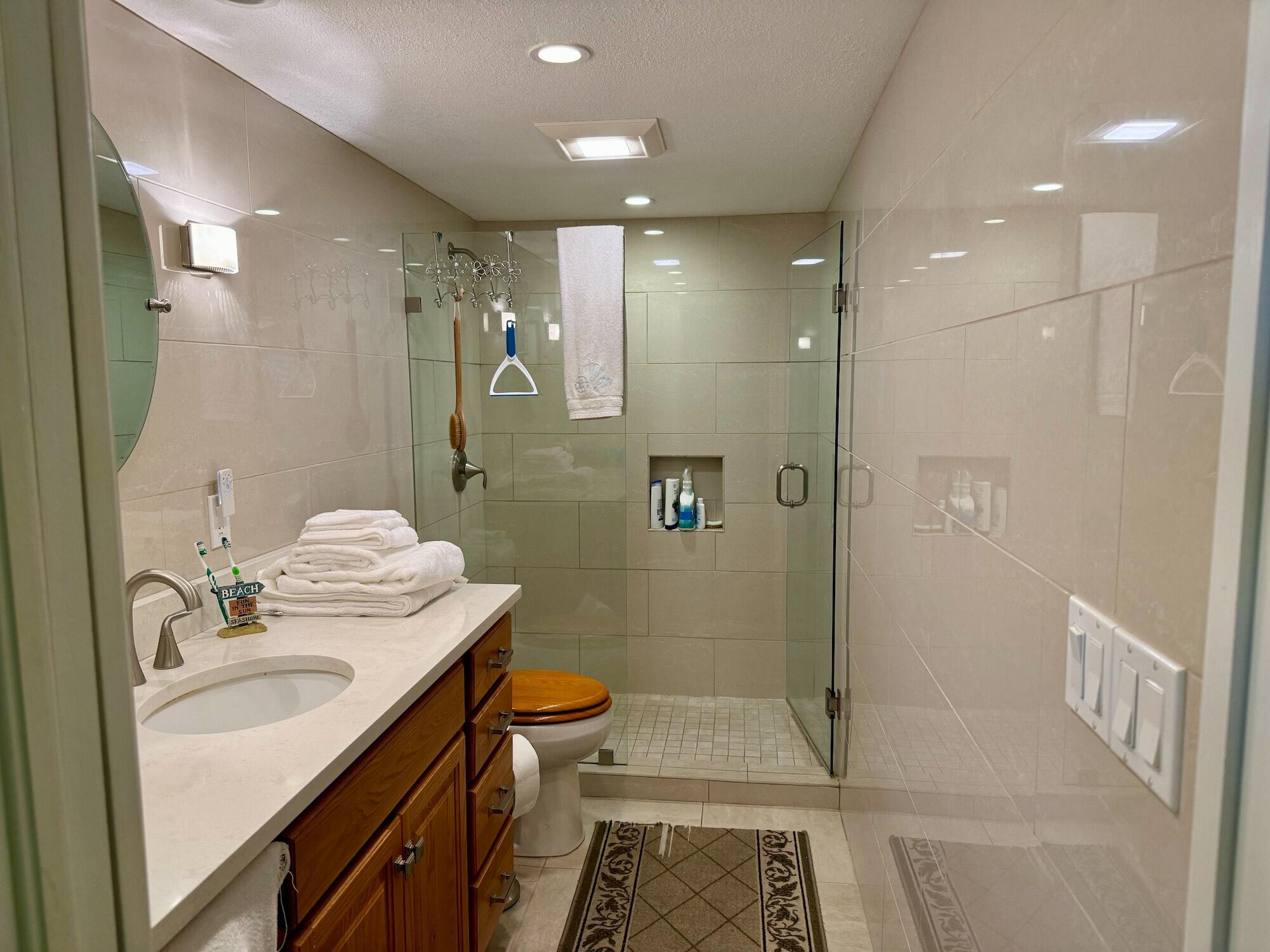1868 Southwest Palm City Road, Unit 202 Stuart, FL 34994 - Photo 14 of 18 a bathroom with a sink a toilet and shower