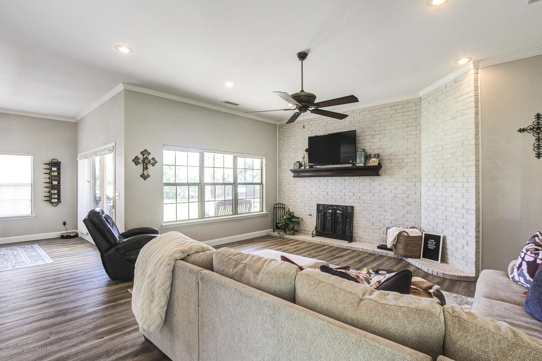 9000 Red Wing Road Amarillo, TX 79119 - Photo 11 of 33 a living room with furniture and a fireplace