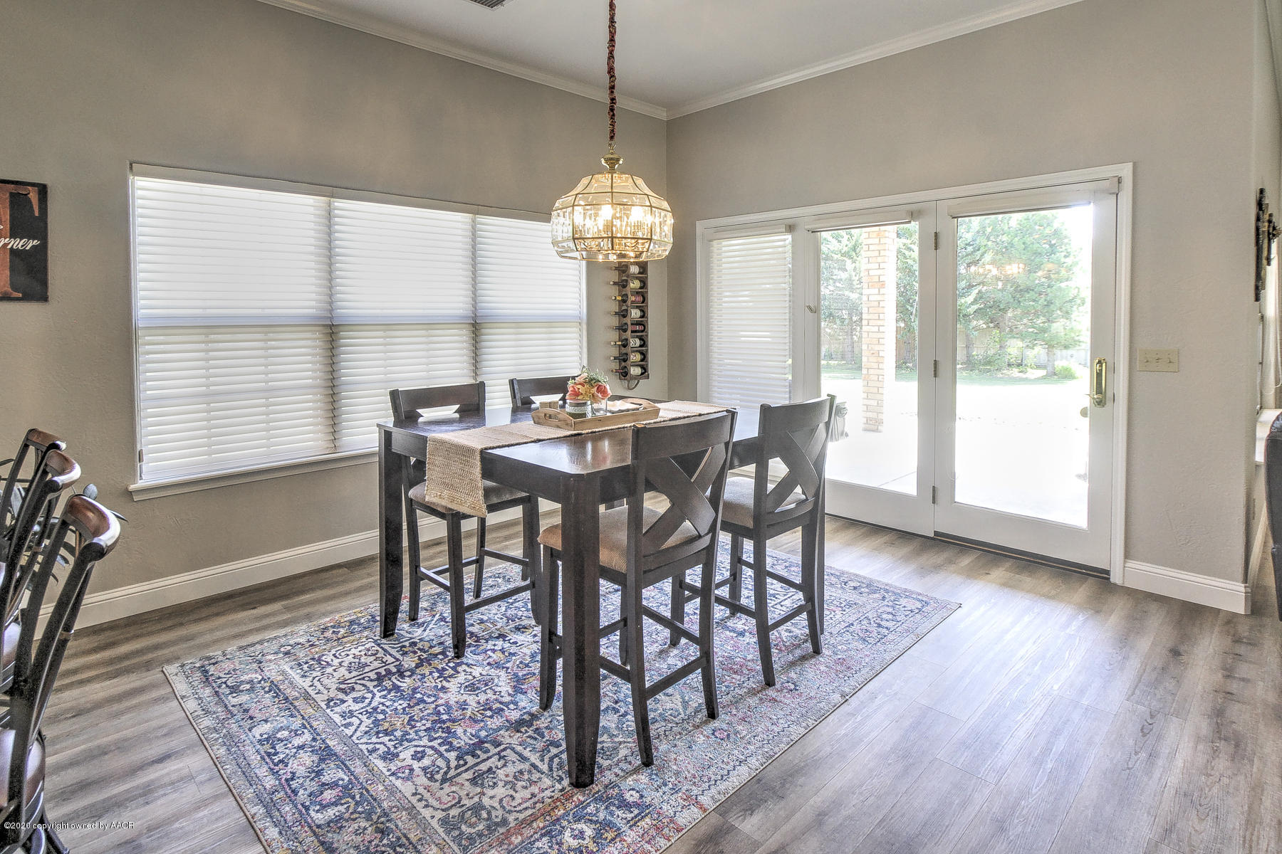 9000 Red Wing Road Amarillo, TX 79119 - Photo 14 of 33 a view of a dining room with furniture window and wooden floor