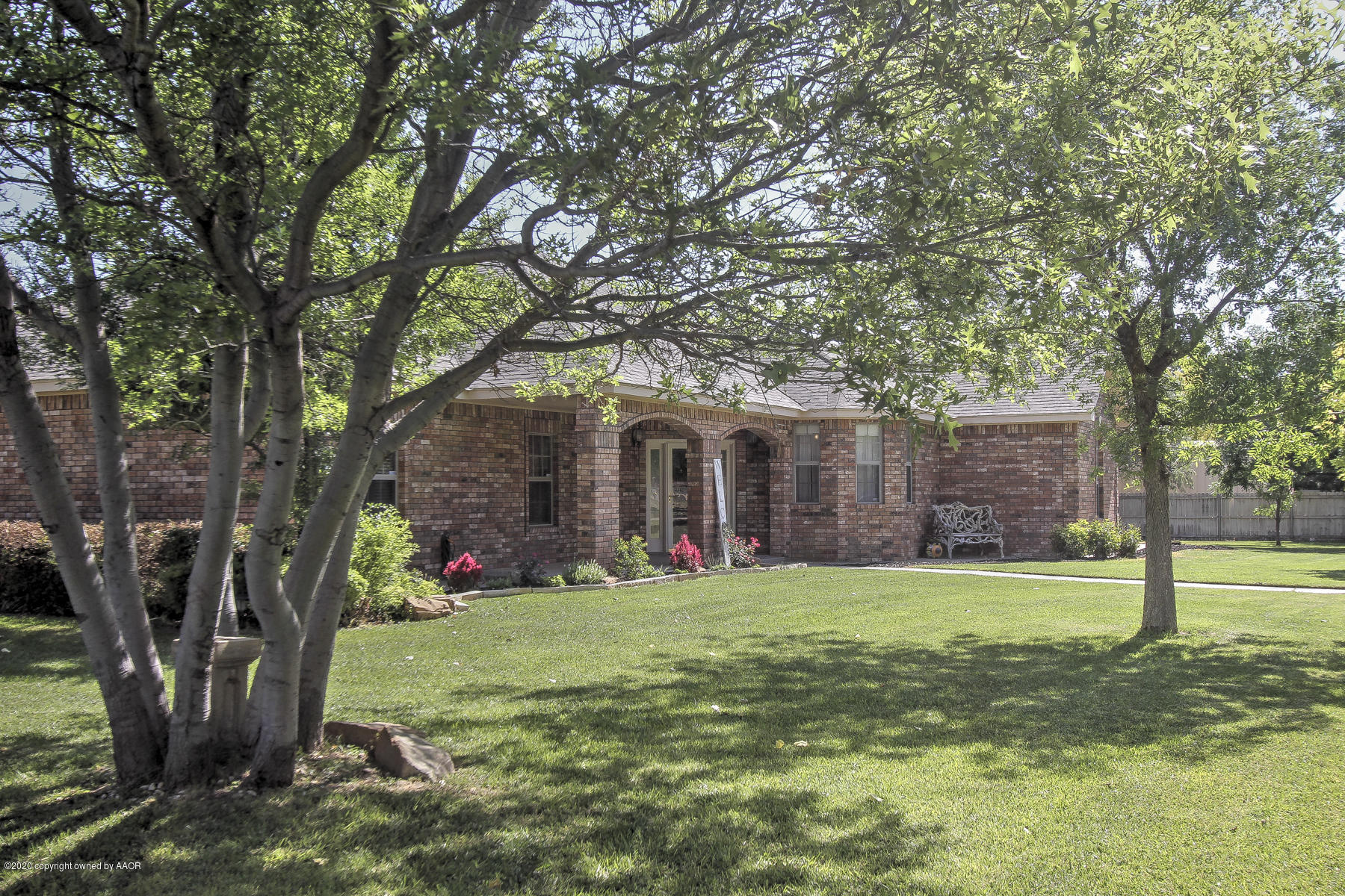 9000 Red Wing Road Amarillo, TX 79119 - Photo 5 of 33 a view of a house with a yard and tree s