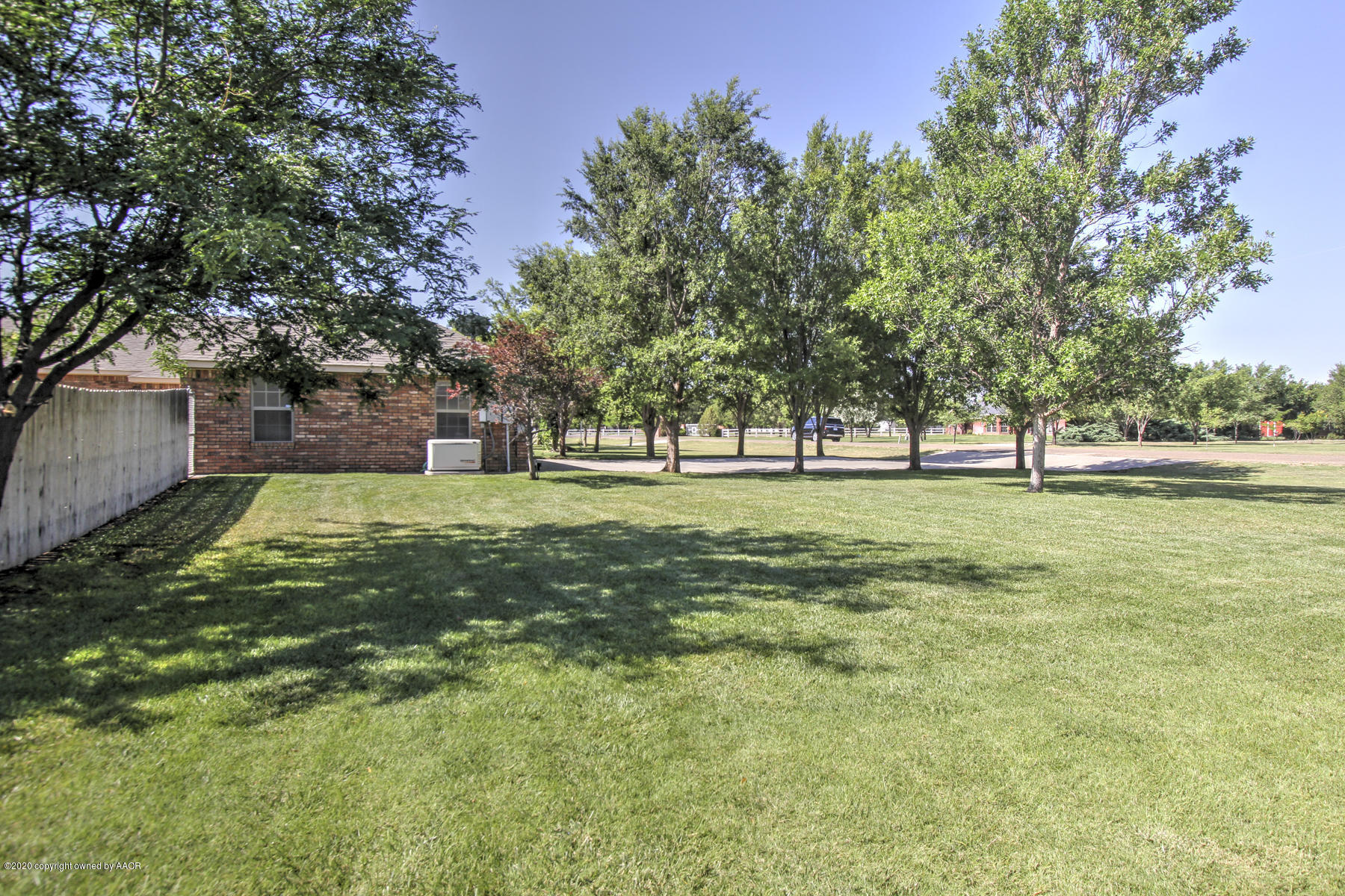 9000 Red Wing Road Amarillo, TX 79119 - Photo 9 of 33 a view of a park with trees in the background