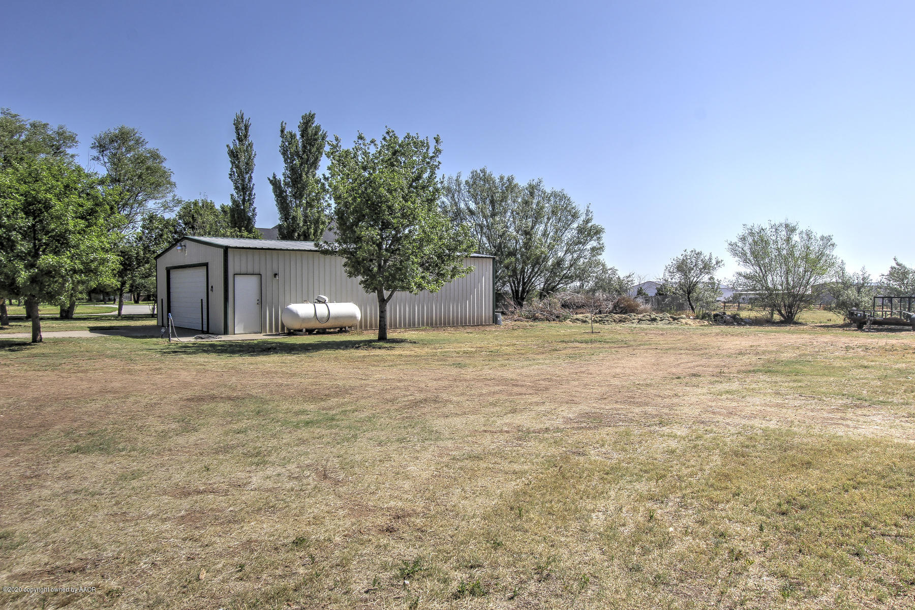 9000 Red Wing Road Amarillo, TX 79119 - Photo 10 of 33 a house view with a garden space