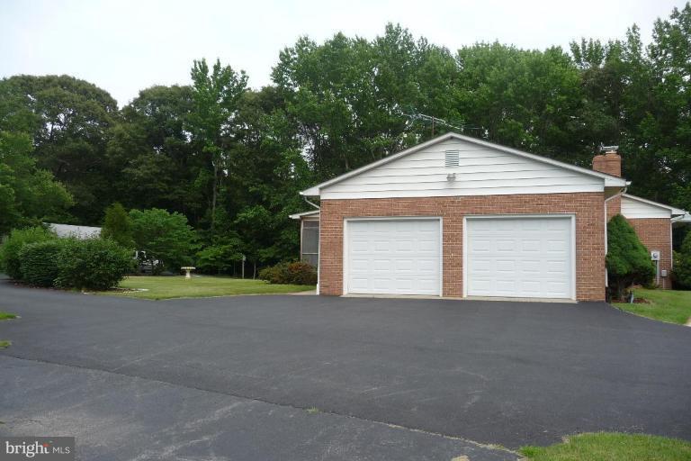 1130 Cox Road Huntingtown, MD 20639 - Photo 10 of 30 a view of a house with garage and yard