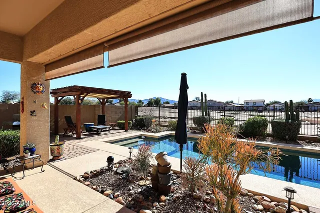 a view of a patio with swimming pool