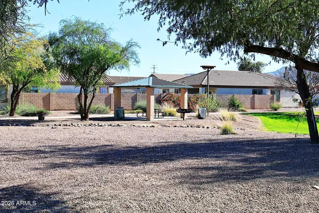 a view of a house with a small yard and plants