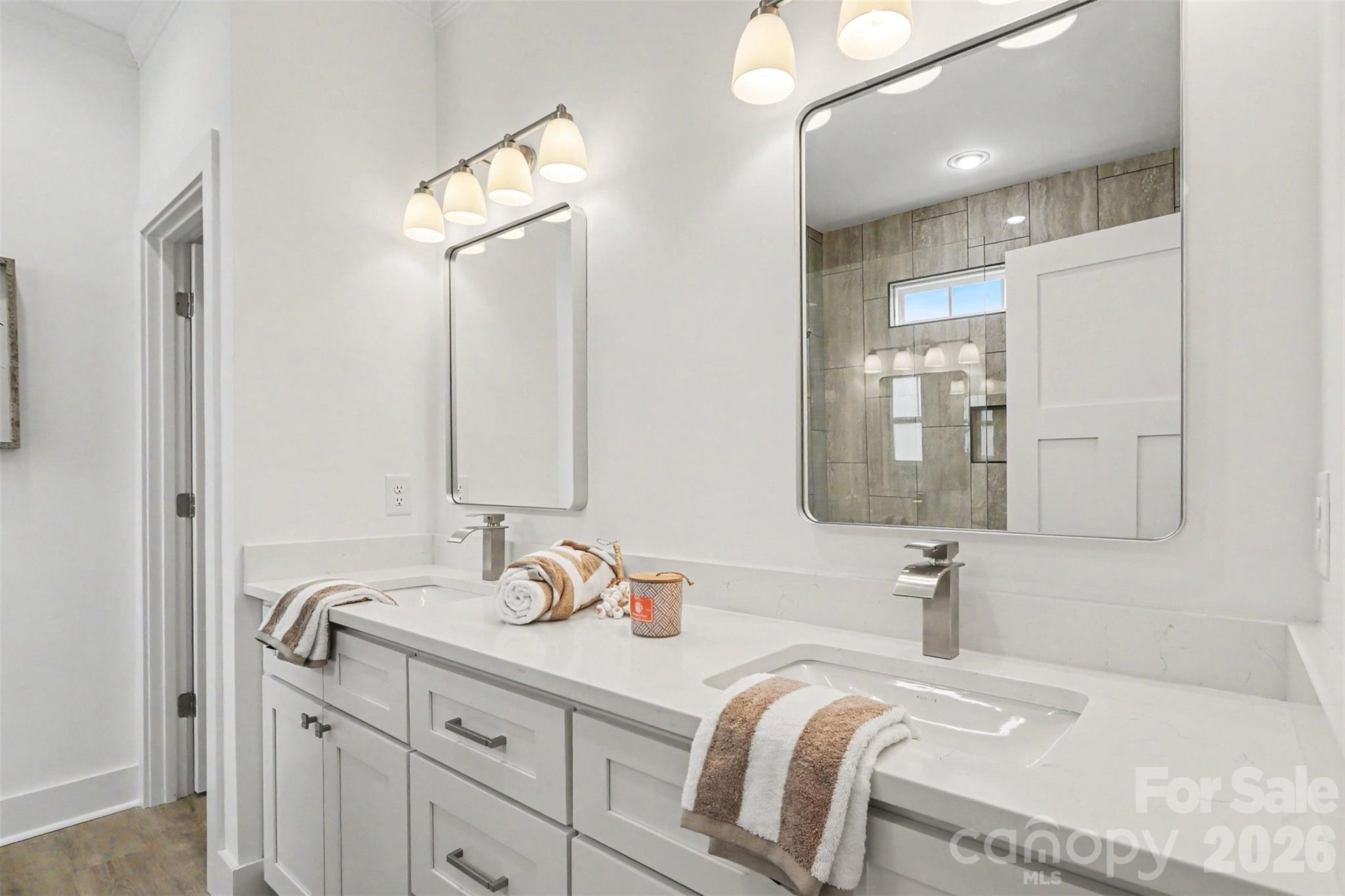 4115 Miller Road Salisbury, NC 28147 - Photo 16 of 26 a bathroom with a double vanity sink and a mirror
