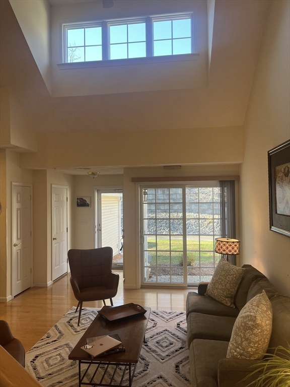 802 Autumn Ridge Drive, Unit 802 Ayer, MA 01432 - Photo 3 of 32 a living room with furniture and a window