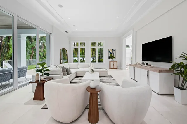 a kitchen with cabinets and a chandelier