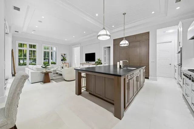 a utility room with sink dryer and washer