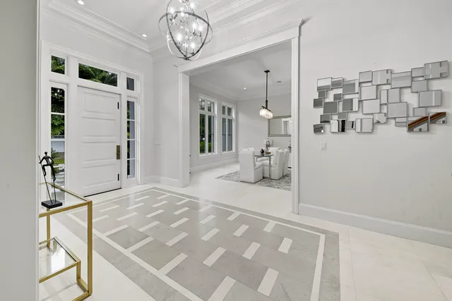 a living room with furniture a window and dresser