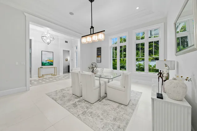 a living room with furniture ceiling fan and a window