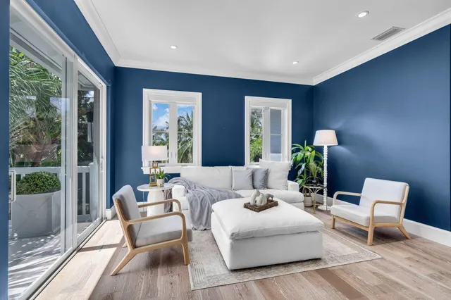a large white bathroom with a large tub sink and window