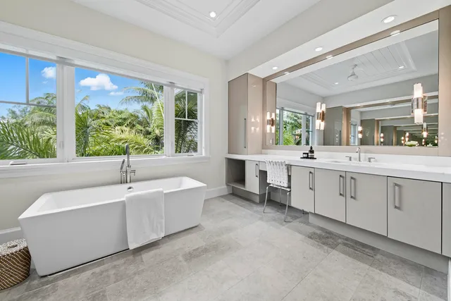 a spacious bedroom with a bed and a large window