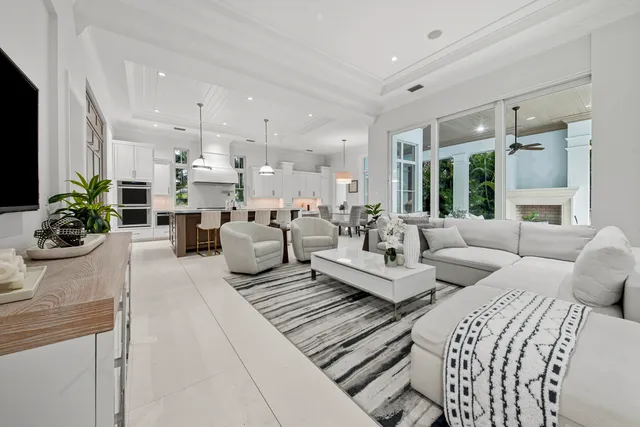 a view of a patio with dining table and chairs