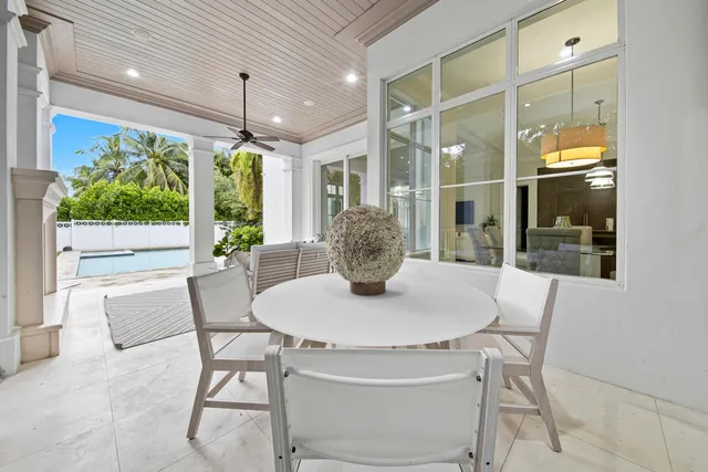 a lobby with furniture and a floor to ceiling window