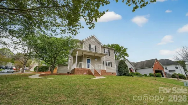 front view of a house with a yard