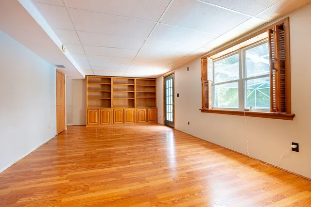 a view of an empty room with a window