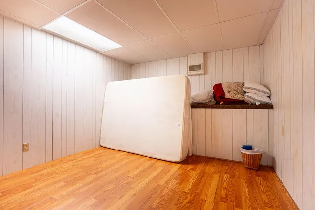 a view of a room with wooden floor and closet