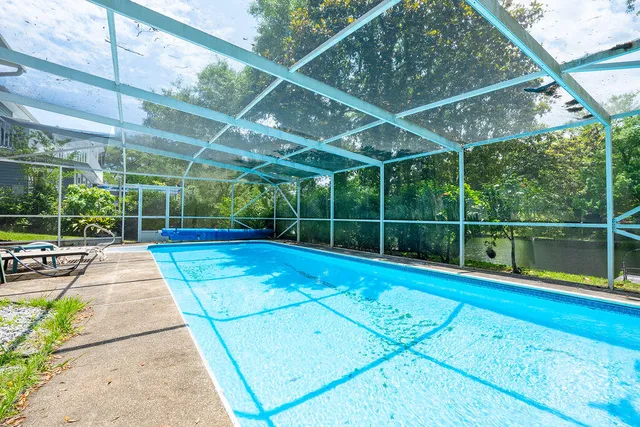 a view of a backyard with sitting area