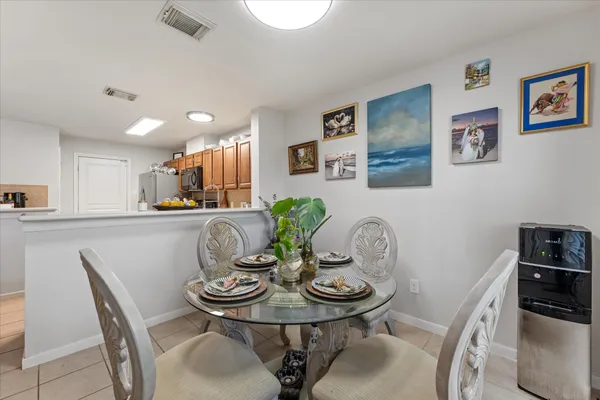 a dining room with furniture and window