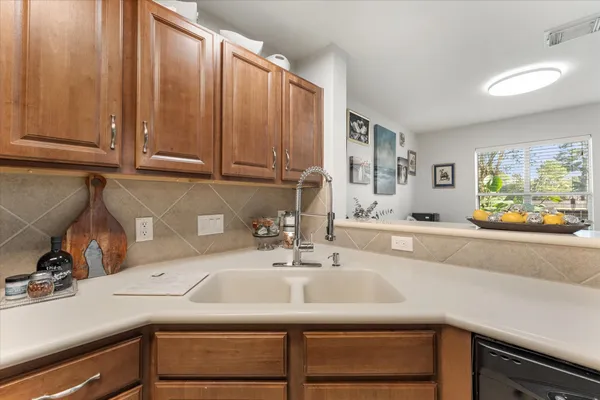a kitchen with a sink and cabinets