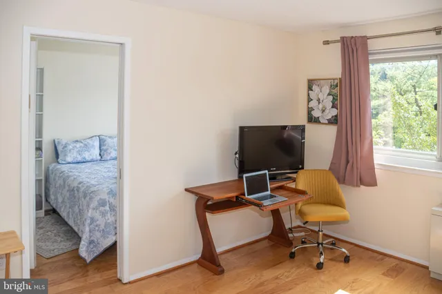 a workspace with furniture and a window