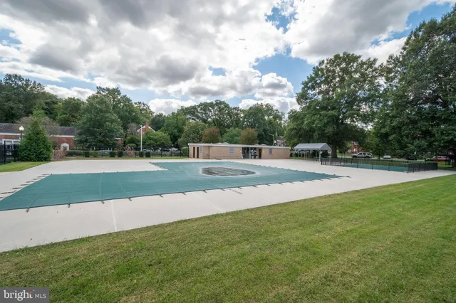 a view of a playground with basketball court
