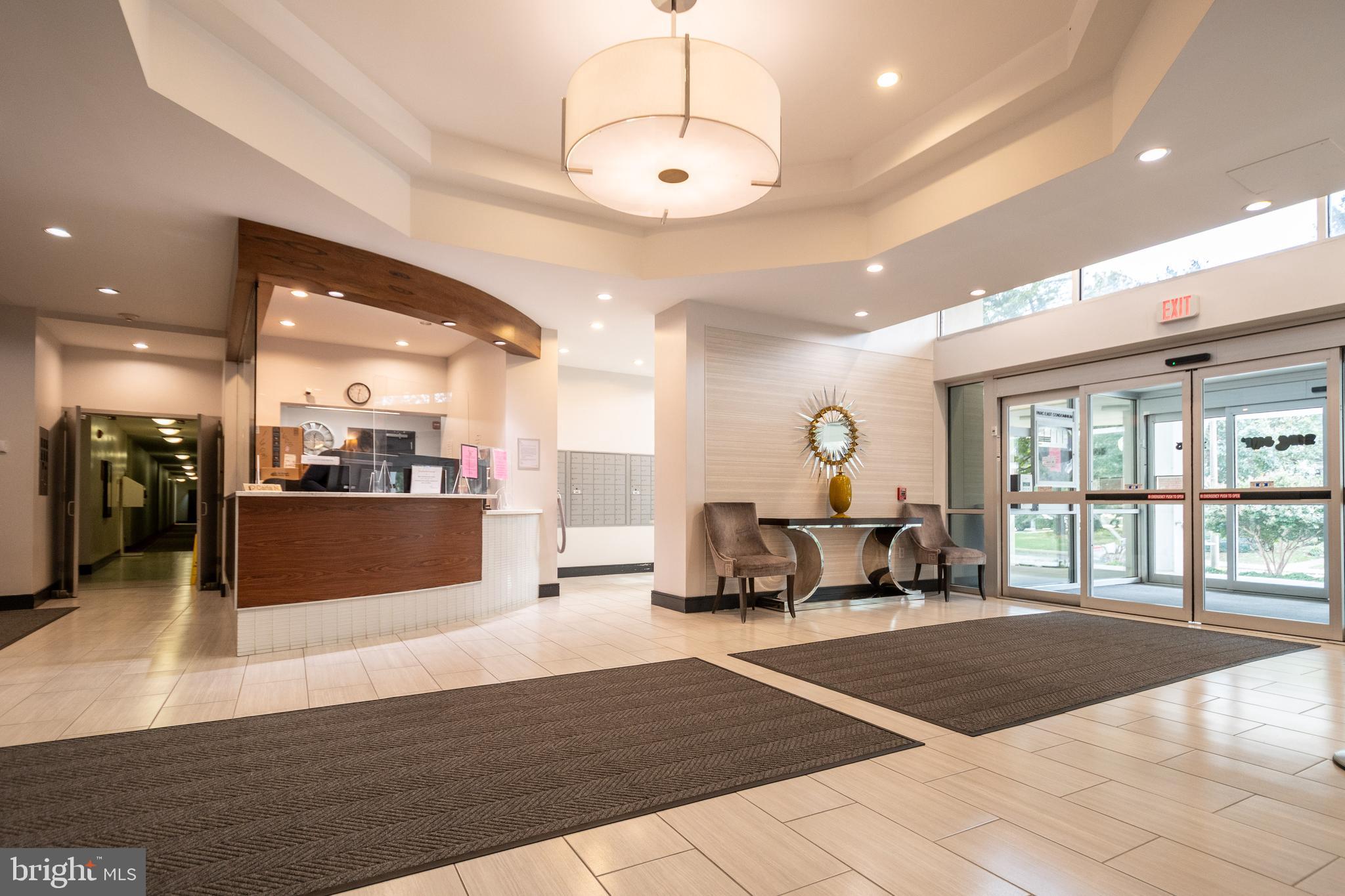 1225 Martha Custis Drive, Unit 502 Alexandria, VA 22302 - Photo 20 of 24 a living room with furniture and a chandelier