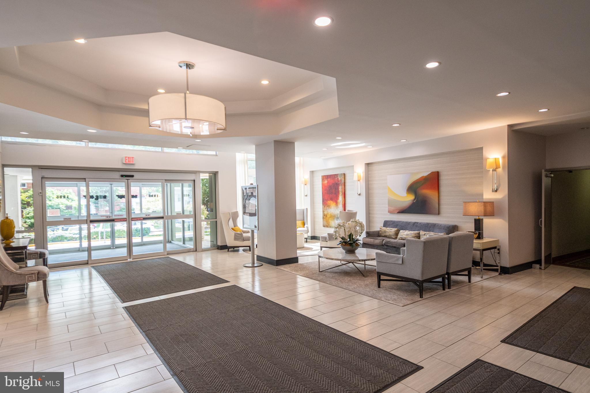1225 Martha Custis Drive, Unit 502 Alexandria, VA 22302 - Photo 22 of 24 a living room with furniture and a chandelier