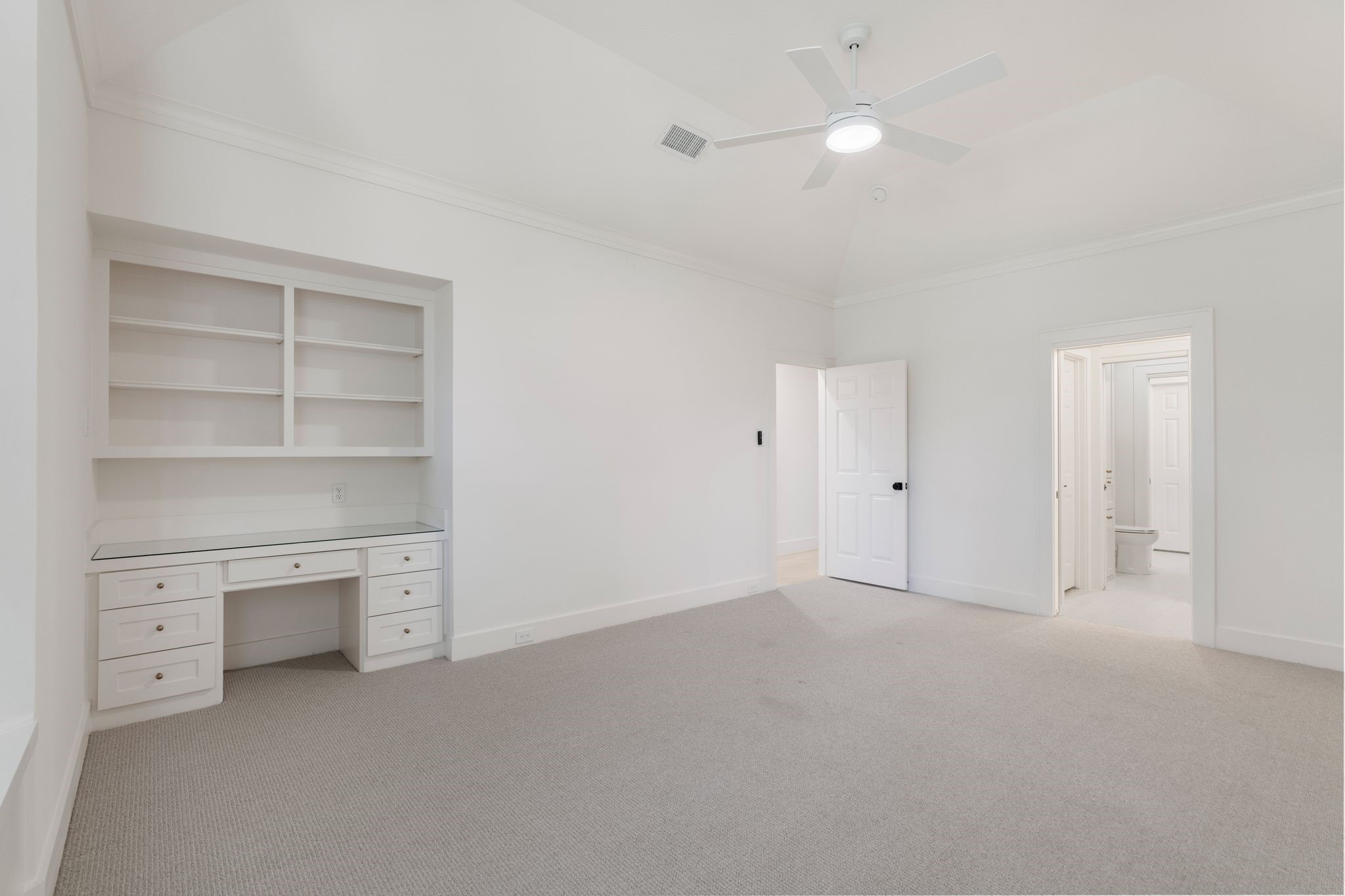 31 Hollymead Drive Spring, TX 77381 - Photo 37 of 50 This spacious bedroom on the 2nd floor features a built-in desk with display shelving. Large walking closiet.