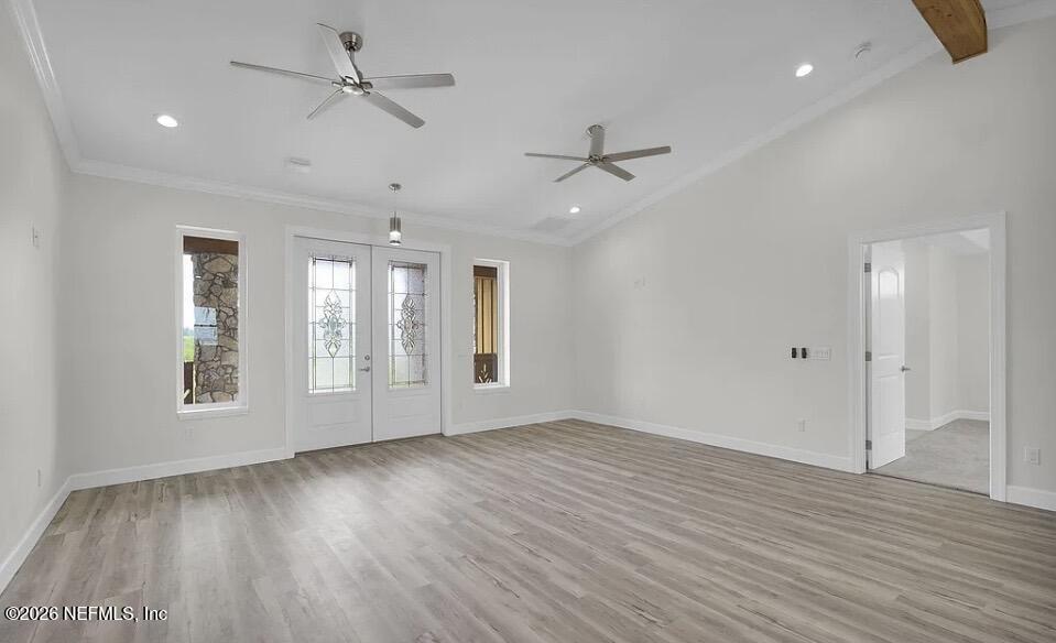 159 Mays Cove Road East Palatka, FL 32131 - Photo 12 of 49 a view of an empty room with a window and wooden floor