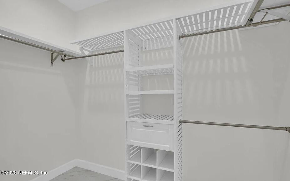 159 Mays Cove Road East Palatka, FL 32131 - Photo 15 of 49 a view of walk in closet with empty racks