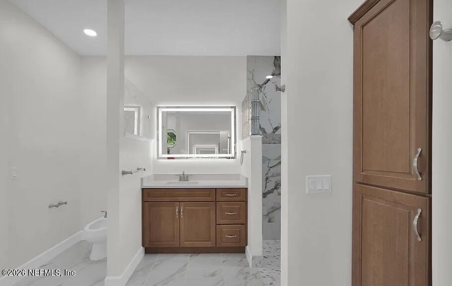 159 Mays Cove Road East Palatka, FL 32131 - Photo 20 of 49 a bathroom with a toilet a sink and mirror