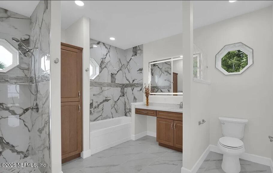 159 Mays Cove Road East Palatka, FL 32131 - Photo 22 of 49 a bathroom with a bathtub sink mirror vanity and toilet